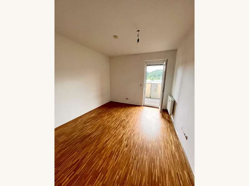 Schlafzimmer mit Ausgang auf den Balkon