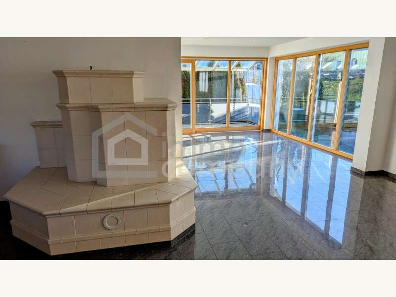 Einfamilienhaus Göfis: Wohnbereich / Grundofen Wohnbereich / Grundofen